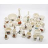 A collection of Goss and crested wares including tea set, miniature on tray, along with display