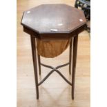 Edwardian sewing table on tapered legs and fabric base in mahogany