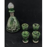 A set of mid 20th century green glassware, comprising:- a decanter and lid and four small glasses (