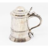 A George II silver tankard and cover, plain body with lower rib on spreading circular foot, domed