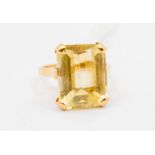 An citrine and 18ct gold ring, comprising a rectangular cut stone approx. 12 x 15mm, claw set,