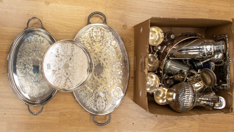 A collection of silver plated items including trays, condiments, tankards, trophy, cocktail