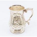 A Victorian silver baluster tankard, profuse chased floral decoration to body, C-scroll handle