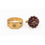 A 9ct gold signet ring, star set to the top with a small diamond, angled shoulders with engraved