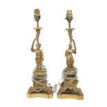 A pair of Italian style gilt metal table lamps, the bodies cast with Renaissance style figures on