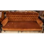 A late Victorian button back sofa  3/4 seater, copper in colour