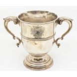 A George II large plain silver two handled loving cup / trophy, central mid rib, scroll handles with