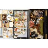 A collection of costume jewellery to include vintage clip on earrings, paste set brooches,