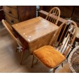 1970's elm kitchen drop leaf table with four matching spindle back chairs