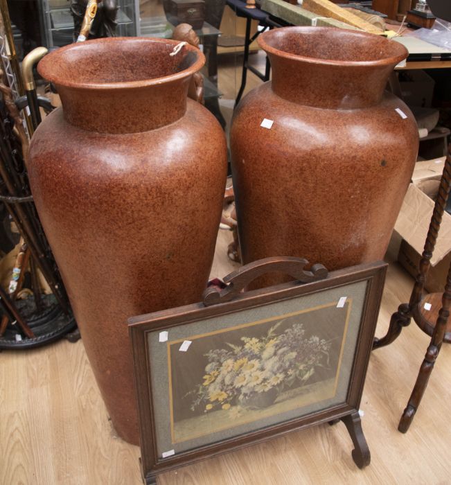 A pair of coated tall terracotta vases 20th Century, along with a mid 20th Century fire screen