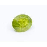 An oval cut olivine loose peridot, weighing approx. 18carats, size approx. 16 x 13mm, heavily
