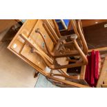 A light oak late 20th Century trestle dining table, with four reproduction Queen Ann dining