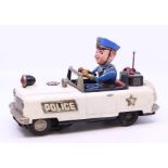 Nomura: An unboxed, battery operated, Nomura, Mystery Police Car, in need of some attention,