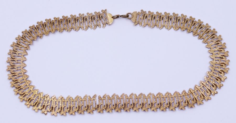 A 1970s textured 9ct gold Choker