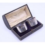 A pair of cased Silver napkin rings