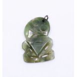 An early 20th Jade Maori Hei Tiki pendant with silver mount