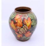 A Moorcroft brown and "autumn" vase: C97, H: 22cm Condition: Good