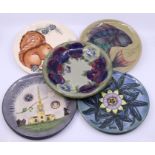 A collection of 5 Moorcroft plates, boxed, diameter: 22cm Condition: Good