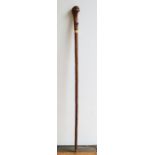 A Walking stick/ sword stick with gilt metal collar and root handle