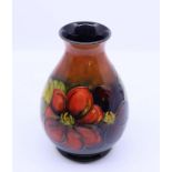 A Moorcroft berry pattern vase, H: 19cm Condition: Good