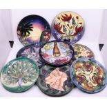 A collection of 8 Moorcroft plates, unboxed, diameter: 22cm (8) Condition: Good