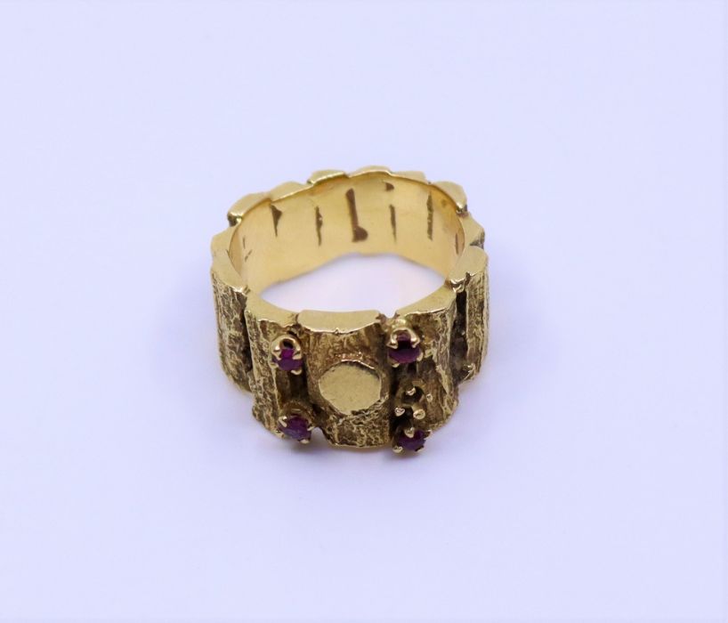 A 1970s heavy textured ring mounted with Ruby