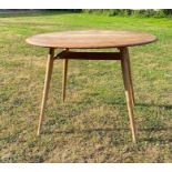 A mid century blond Elm Ercol pebble table