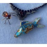 A 20th cent yellow metal enamel fish pendant, a yellow metal spider brooch and a white metal and