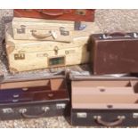 A collection of vintage luggage, doctors cases, leather and vellum
