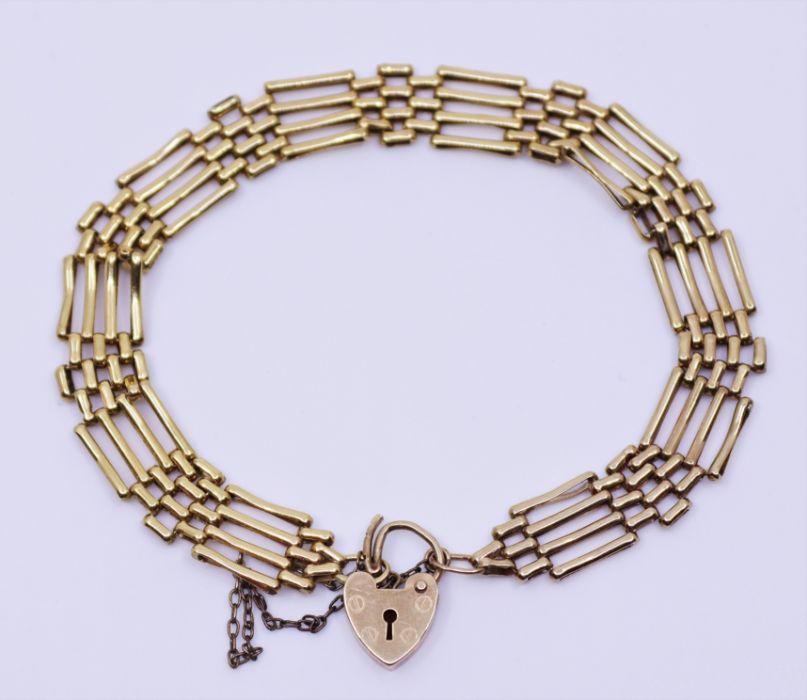 A 9ct gold padlock bracelet