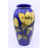 A Moorcroft "buttercup" vase, H: 26cm Condition: Good