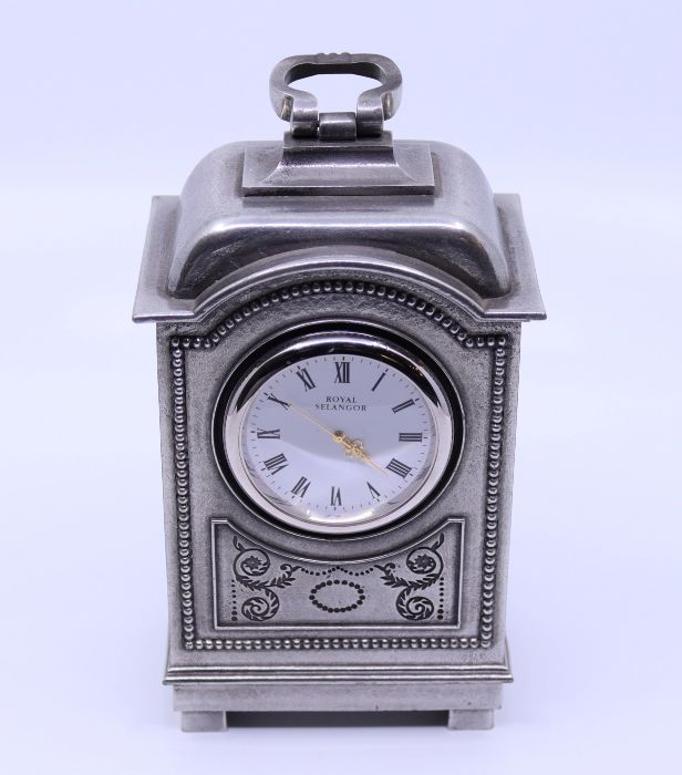 A pewter mantle clock, inscribed To Betty Boothroyd from NOAB 1999 Property of Baroness Boothroyd