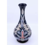 A Moorcroft dark blue, white and pink vase, C95, H:32cm Condition: Good