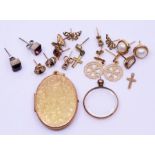 A 9ct gold locket and a collection of gold earrings