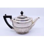 An Edwardian silver Goldsmiths and Silversmiths teapot , total gross 500g