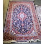 A part silk reg and blue ground Qum rug 146cm by 230cm