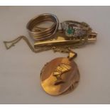 A gold Egyptian pendant, a 9ct gold ring, a gold Jade mounted ring, a yellow metal chain and money