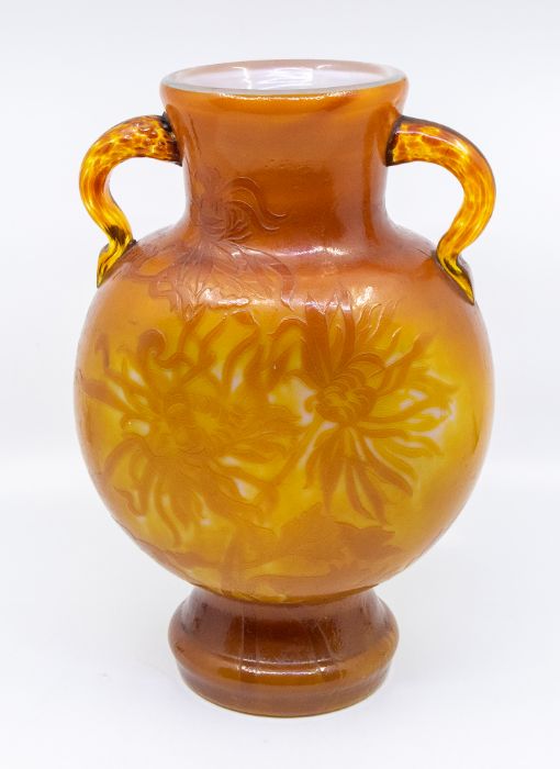 Émile Gallé, an Art Nouveau twin-handled cameo vase, etched with spider flowers, in orange tones,
