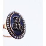 A late Georgian blue enamel Mourning ring of navette form encrusted with old cut diamonds