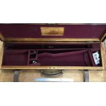 Leather bound Oak gun case by Stephen Grant & Joseph Lang Ltd of London.