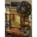 A Victorian black painted papier mâché tilt top table, the shaped circular top painted with