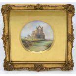 A Royal Worcester circular plaque, painted with Whitby Abbey and cattle with river in foreground,