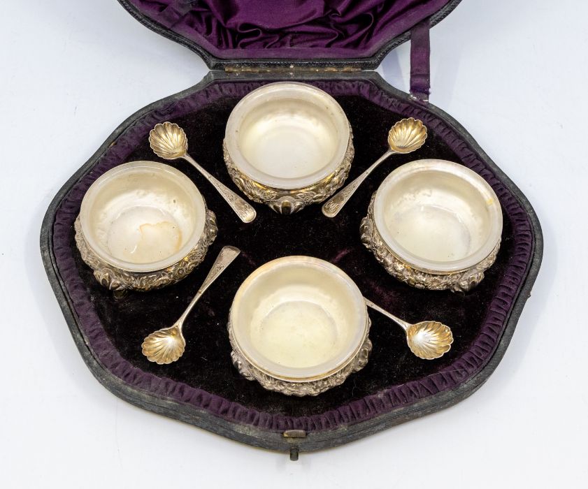 A set of four Victorian silver salts, cauldron shaped plain beaded rims, the bodies chased with