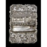 Nathaniel Mills: A Victorian silver castle top card case, the front chased in high relief with