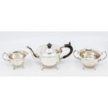 A late Victorian silver Bachelor three piece tea set, flared wavy rims above plain bodies on shell