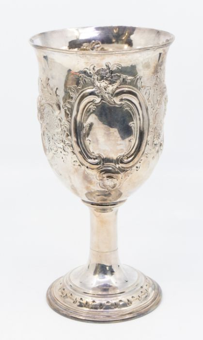 A George III silver large goblet, the body chased with a central band of flowers and foliage, vacant