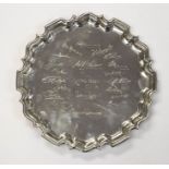 A George V silver salver, pie crust border on three scrolling feet, the centre with autograph