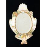 A 19th Century porcelain wall mirror, central oval mirror with gilt beaded border, the body with