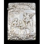 An Edwardian silver card case, the front chased with a group of 18th Century figures: two ladies