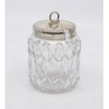 A George V silver mounted cut glass condiment jar, the silver cover with beaded rim and wriggle